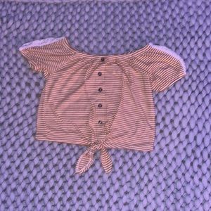 Yellow/orange cropped shirt.